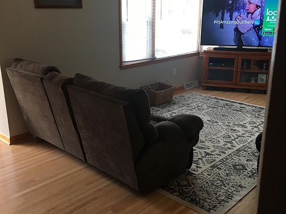Living room with refinished wood flooring