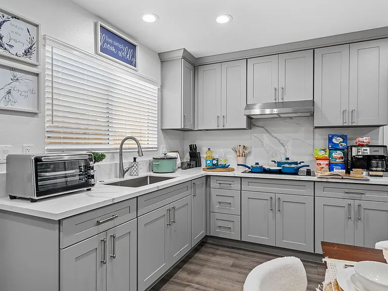 Fully equipped kitchen with coffee maker, blender, and all the essentials for a comfortable stay.