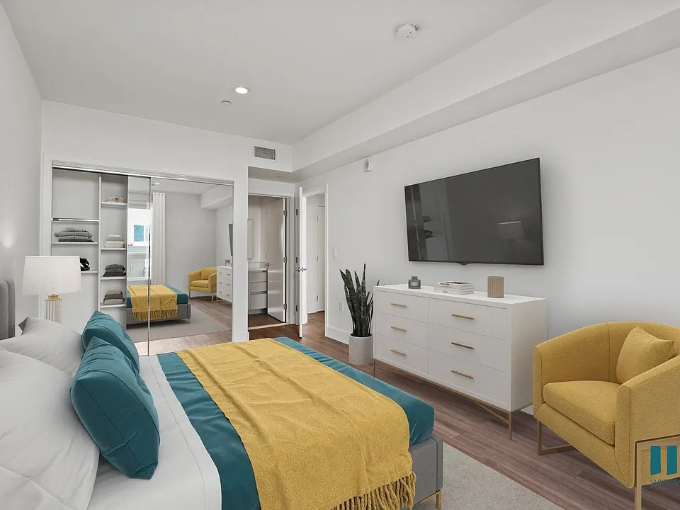 Bedroom with Mirrored Closet with Shelving, Bathroom, and Vinyl Flooring