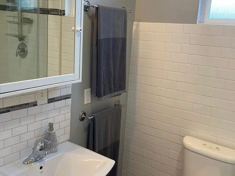 Bathroom (Medicine storage cabinet) There is also has an additional mirrored storage cabinet directly behind the door.