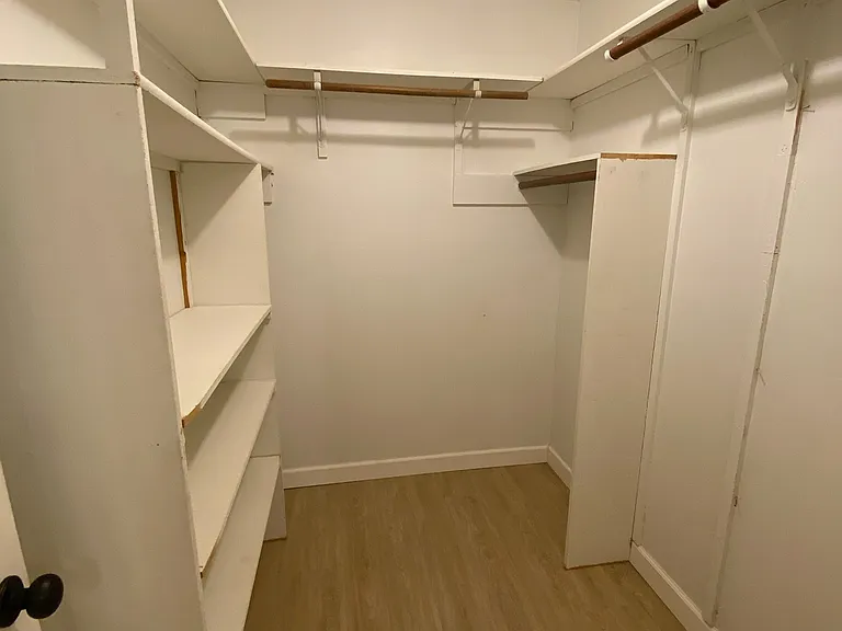 Primary bedroom walk-in closet