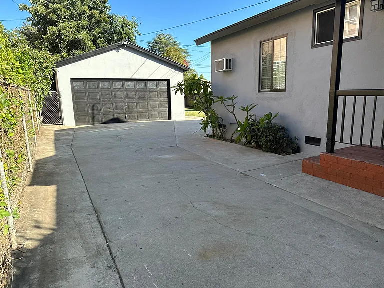 Driveway parking behind gate and full 2 car garage with laundry - washer & dryer included.
