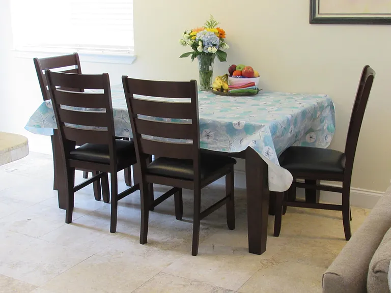 The dining table seats seven with a bench (out of view).