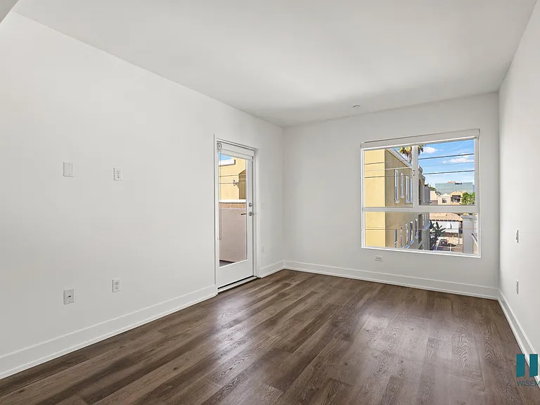 Living Room with Vinyl Flooring, Recessed Lighting, and Patio