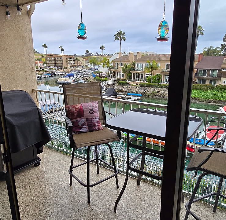 Living room balcony looks out over lagoon.