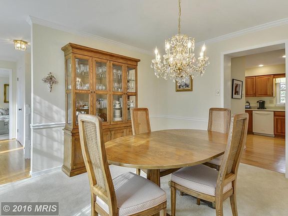 Dining Room features crown molding and chair rail