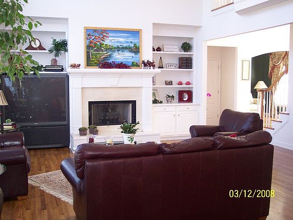 Built in bookshelves next to family room fireplace