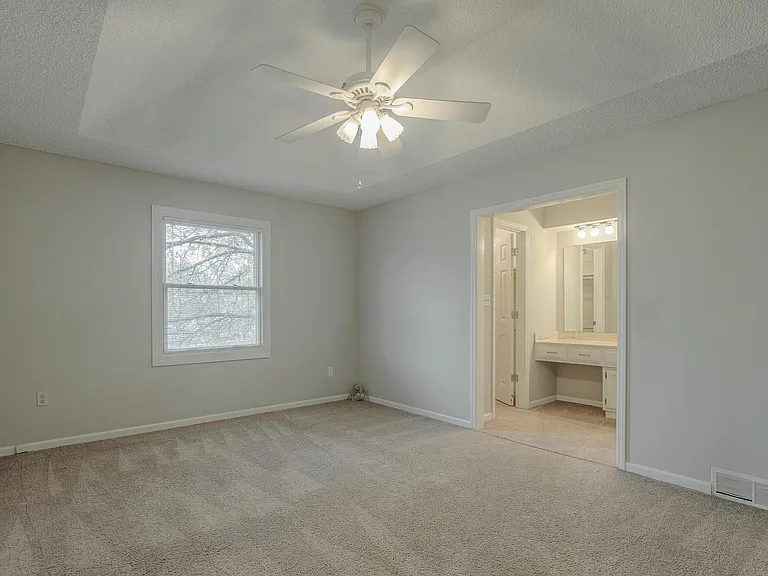 Large master with a vaulted ceiling and plenty of closets. NEW CARPET, REPAINTED, NEW VANITY.