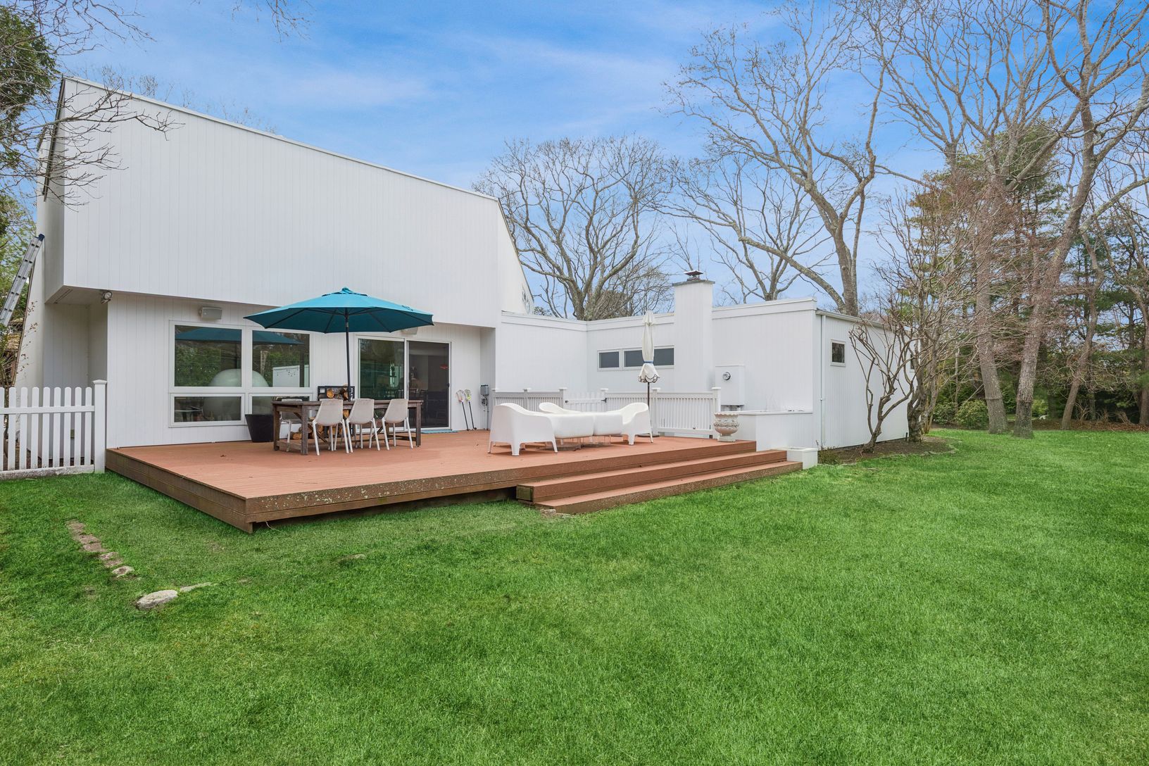  Outdoor deck by tennis court.