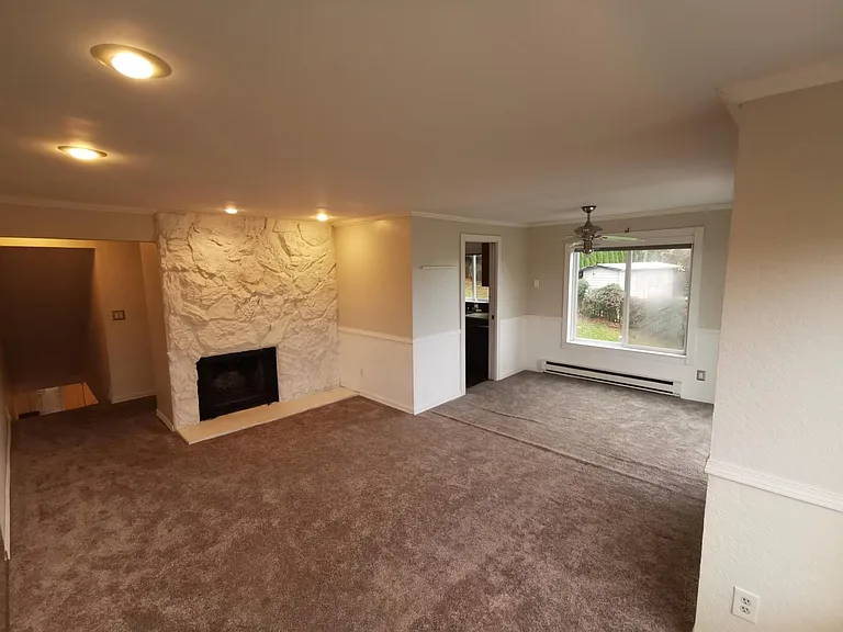 Living room also has fireplace and place to mount flat screen TV.