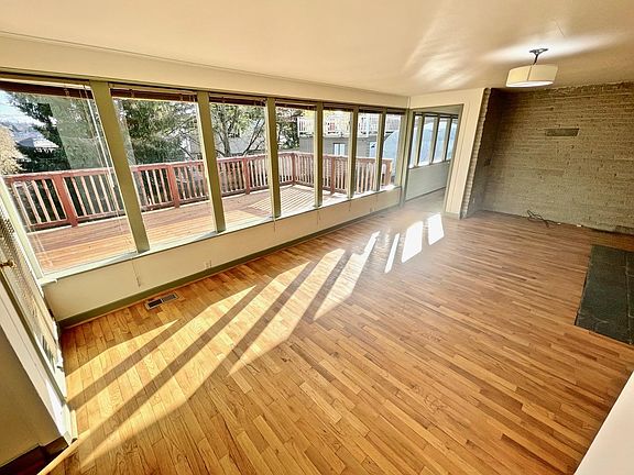 Spacious and open Living Room view of yard and deck