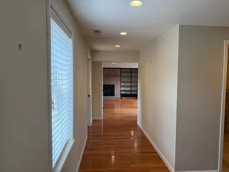 hallway to livingrom and upstairs stairway