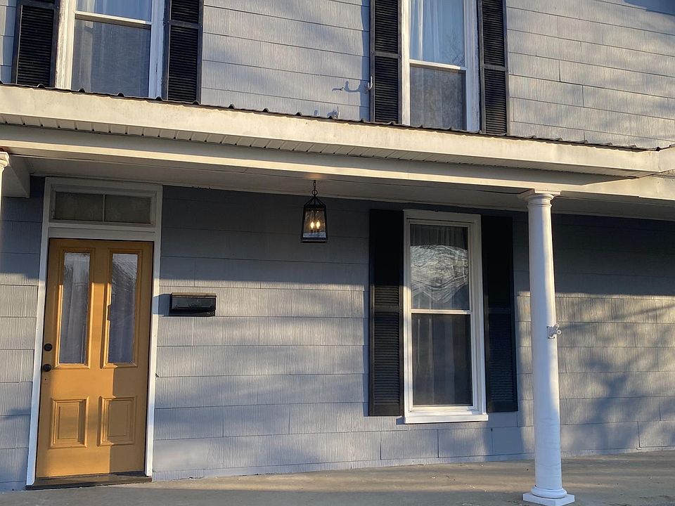 This farmhouse style duplex was built before electricity, but it is updated with modern conveniences.