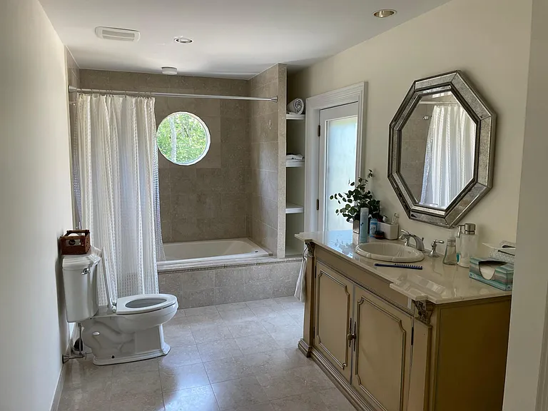 First floor full bathroom off kitchen and gym area