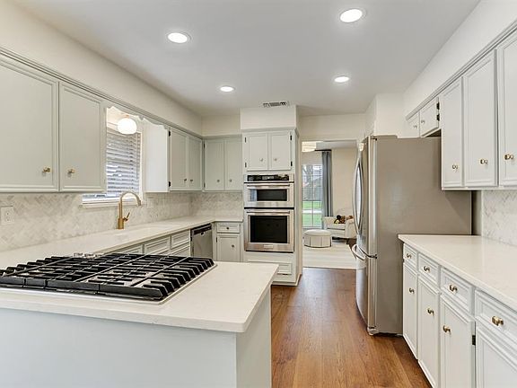 Large Kitchen boasts new stainless steel appliances, quartz countertops, and backsplash (2020)