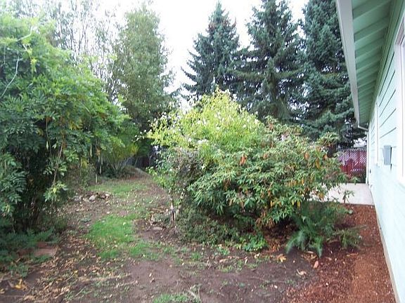mature landscaping as well as patio
