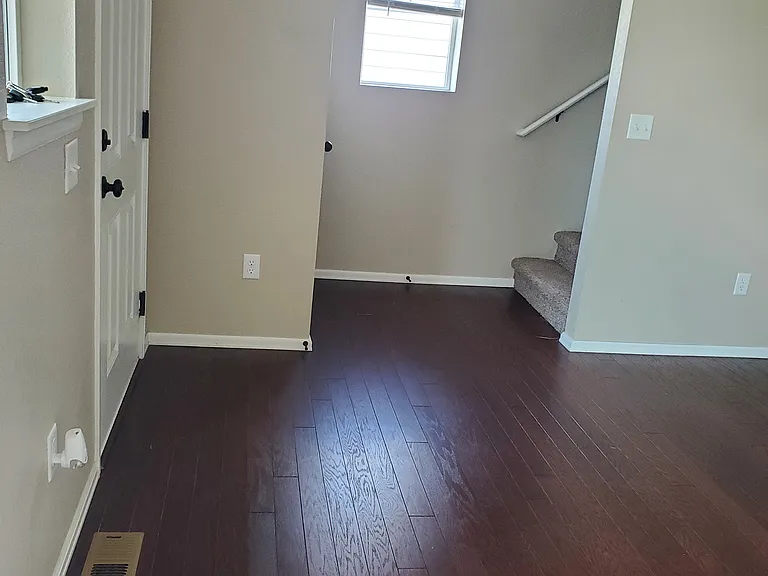 inside front door and bottom of stairs