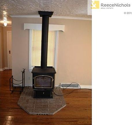 Wood burning stove in living room.