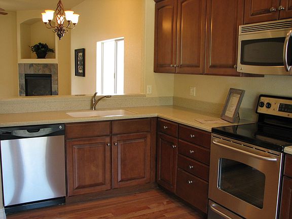 Stainless Steel applicances and Solid Surface Countertops