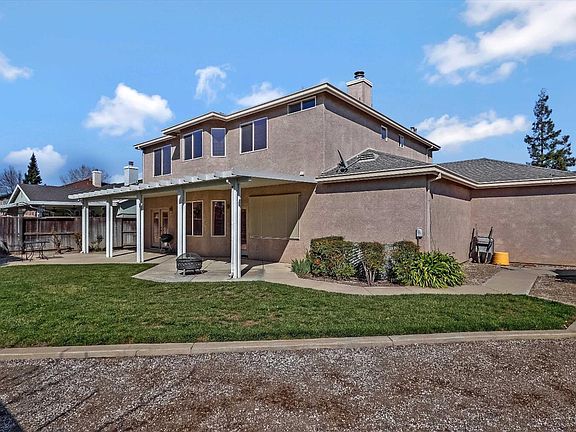 Well maintained backyard with covered patio.