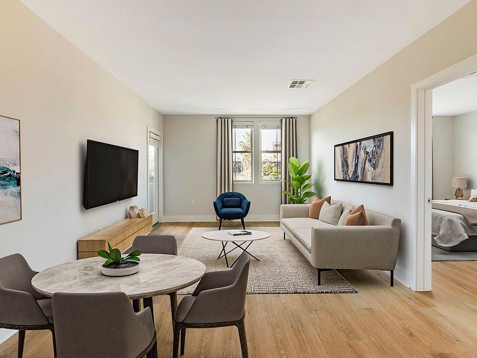 Renovated Package I dining and living room with hard surface flooring