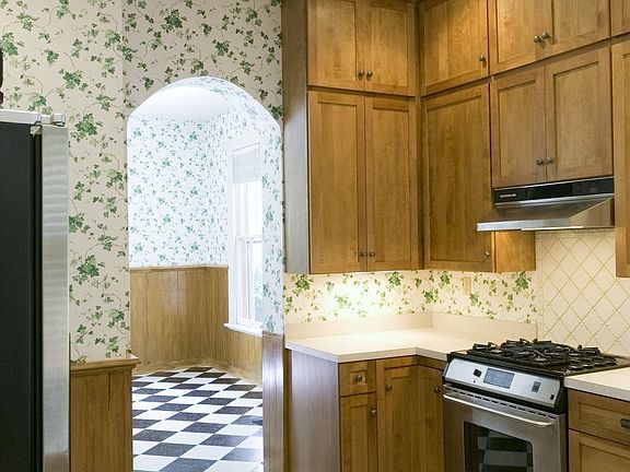 Kitchen with archway to eating area