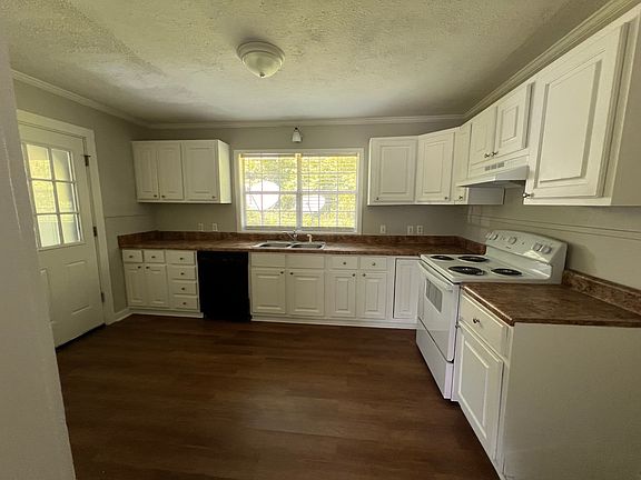 Kitchen
The door on the left leads to a hallway to the backyard or the laundry