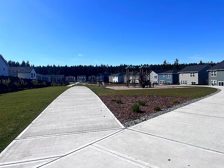 No direct front yard neighbors. And close to community green space and playgrounds.