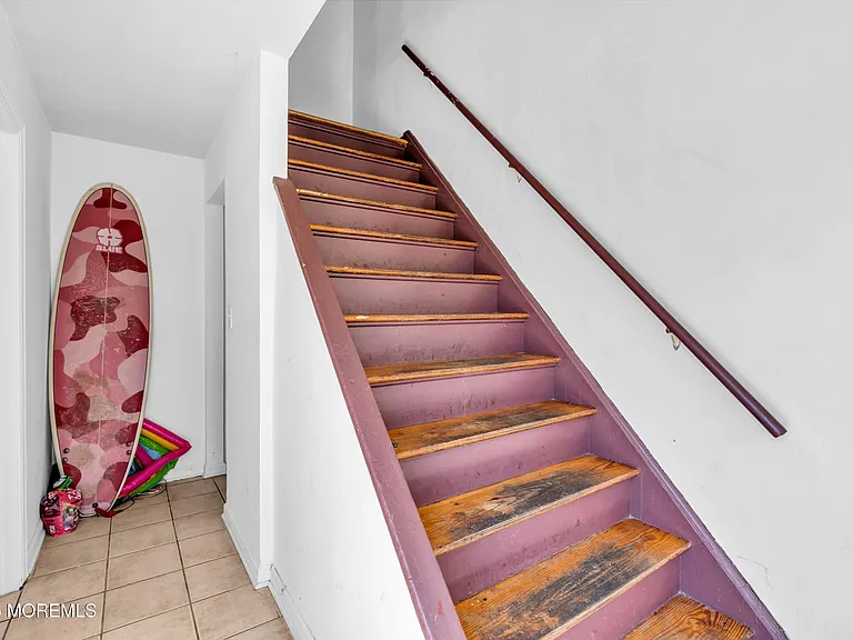 Private stairway entrance to the unit (photo taken mid-renovation)