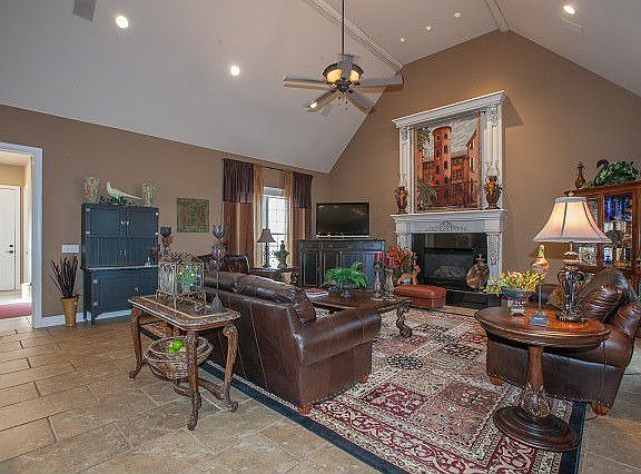 Vaulted ceiling and fireplace in one living room