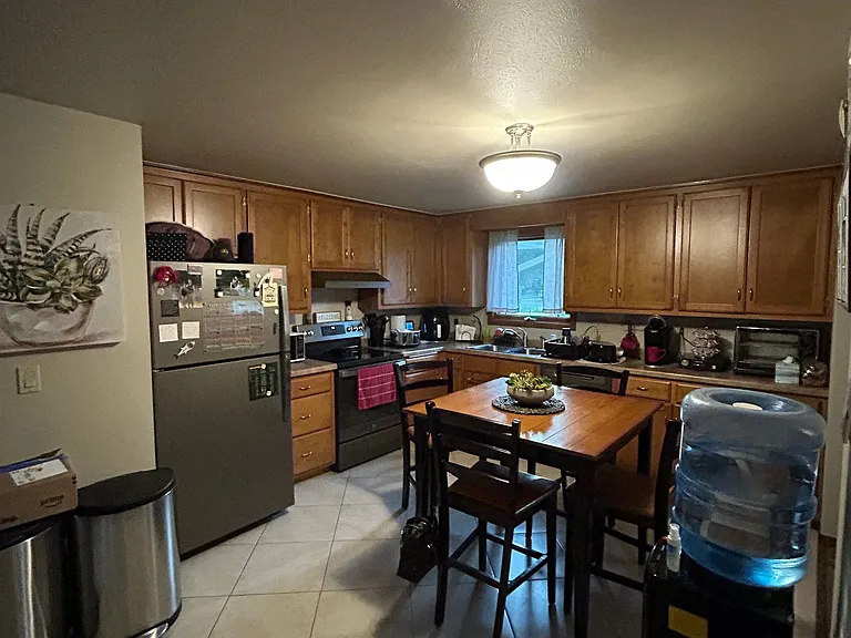Large eat in Kitchen w/ newer slate GE appliances and tons of cabinets