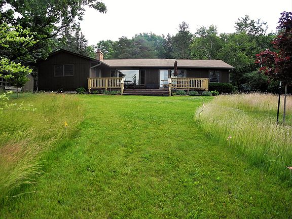Backyard facing cottage & large deck