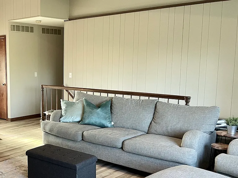 Living room seating - staircase to the lower walk-out basement behind it.