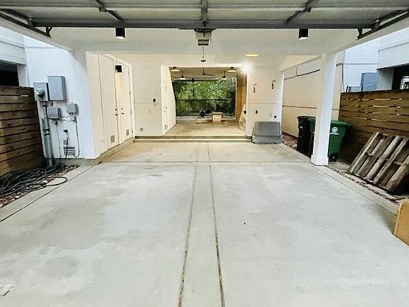 3 car garage open to the back yard