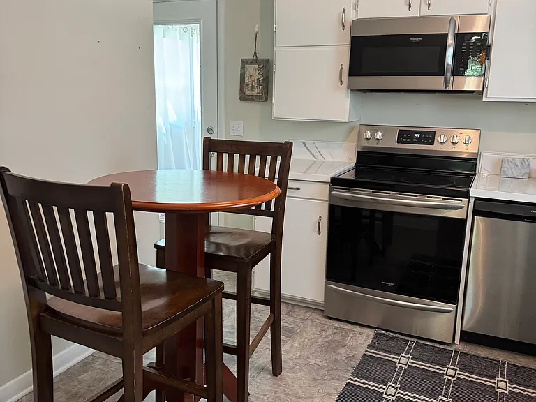 Kitchen with Bar top and chairs