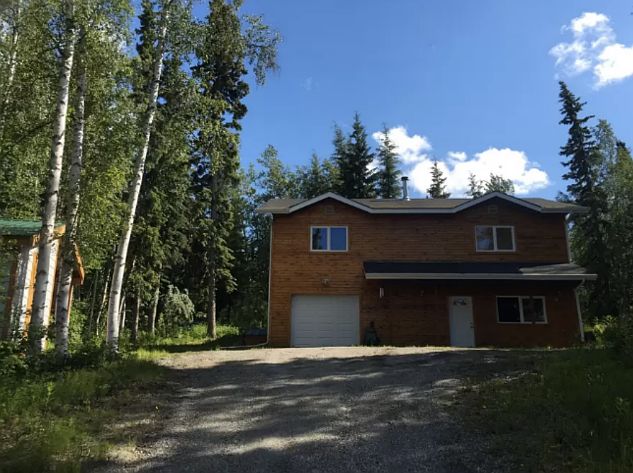 Looking up driveway to front of house