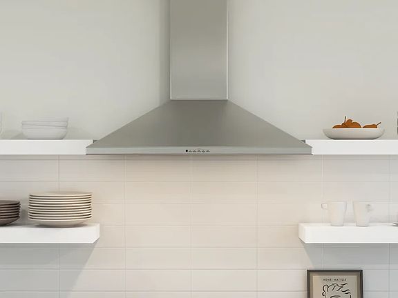Kitchen with floating shelves and stainless steel hood