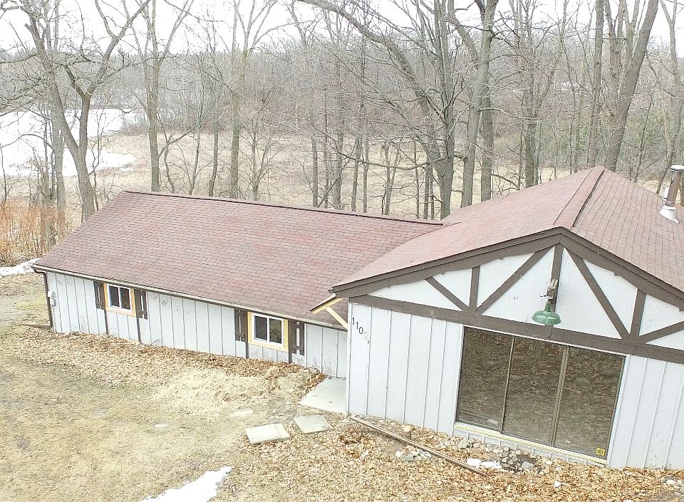 House located on bluff overlooking lake