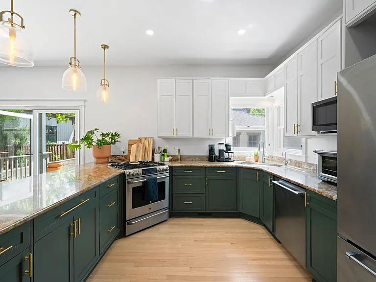 Large Kitchen with Eat-In Bar, Pendant Lights, and Stainless Steel Appliances