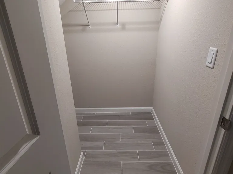 Understairs coat and storage closet