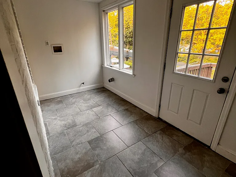 Enclosed porch with laundry hook up