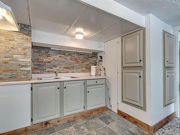 Kitchen includes new flat-top stove (not pictured) and full-sized refrigerator (not pictured).