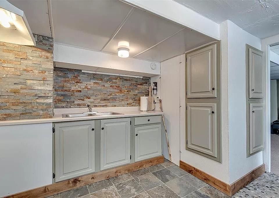 Kitchen includes new flat-top stove (not pictured) and full-sized refrigerator (not pictured).