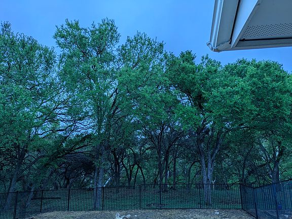 View of back of the lot. There is a creek below and Preserve with Lakeway Trails on the other side of the creek.
