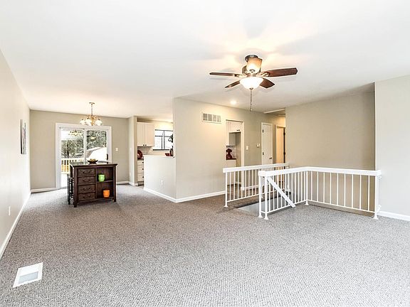Open floor plan living room flows to Dining Room.  NEW Carpeting.