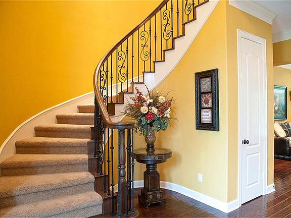  The graceful curving staircase gives the foyer a feel of elegance.