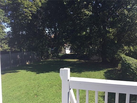 Private rear yard with deck