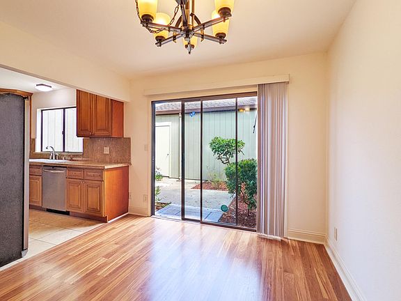 Dining area with sliding glass door to patio and garage.