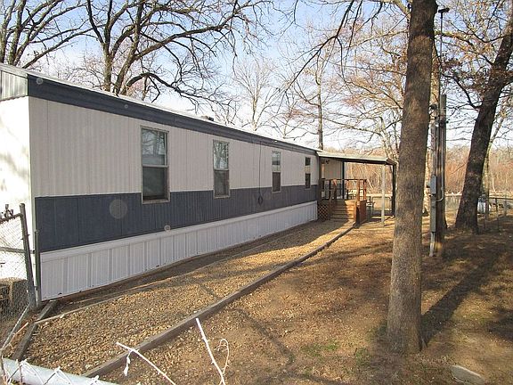 Fenced yard and front entry.