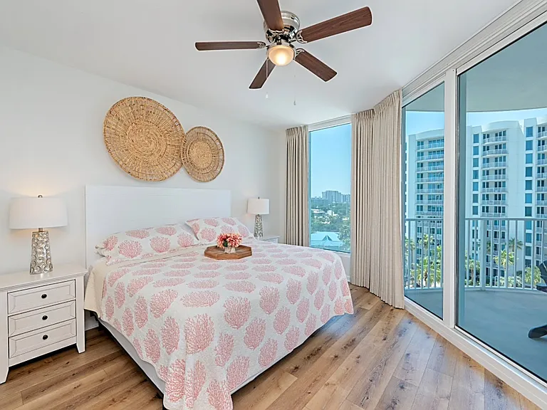 Your large primary bedroom features its own entrance to your private patio through the sliding glass doors